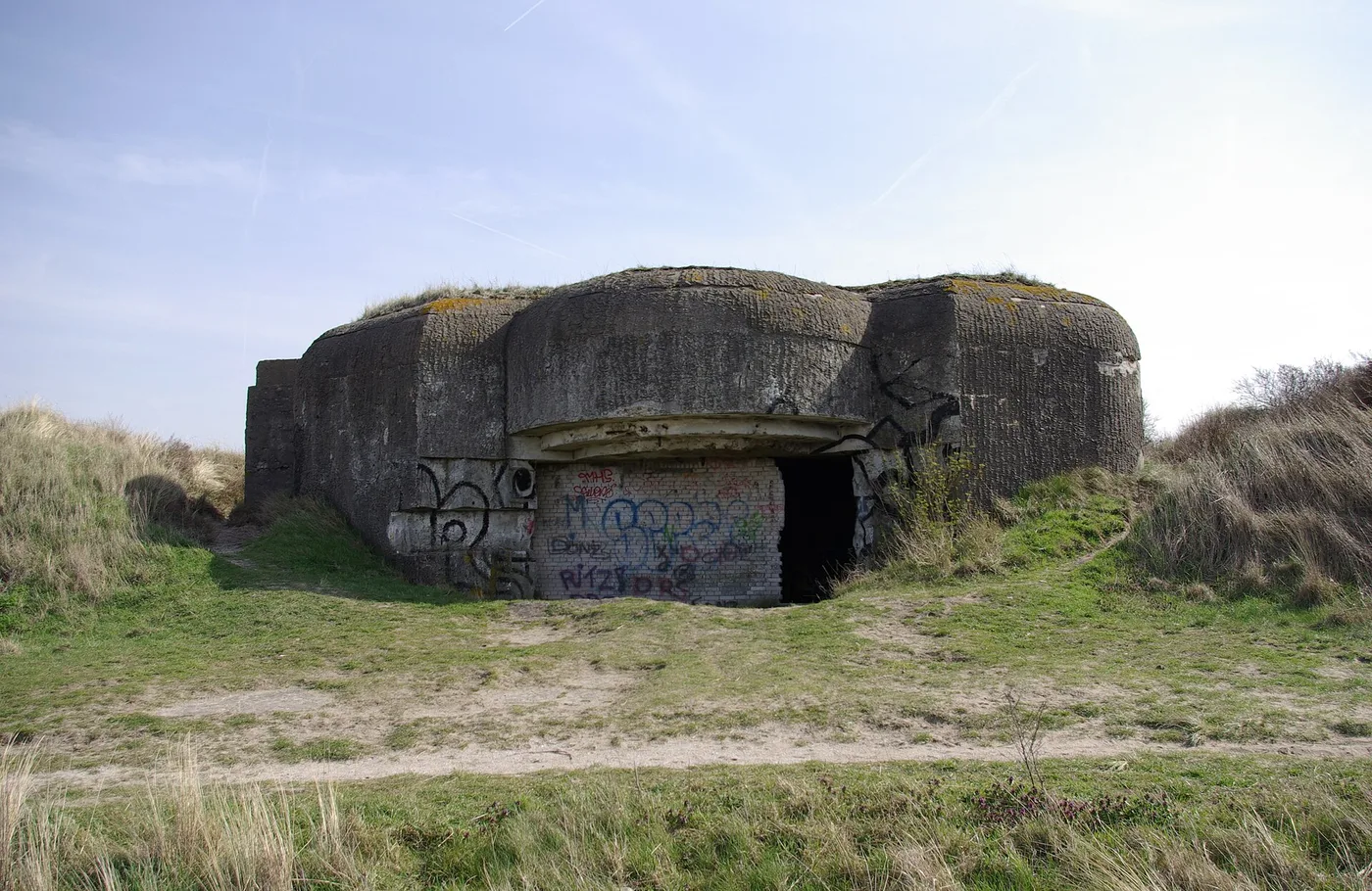 Abandoned Atlantikwall gun bunker M272 covered in graffiti in the dunes of Batterij Heerenduin near IJmuiden