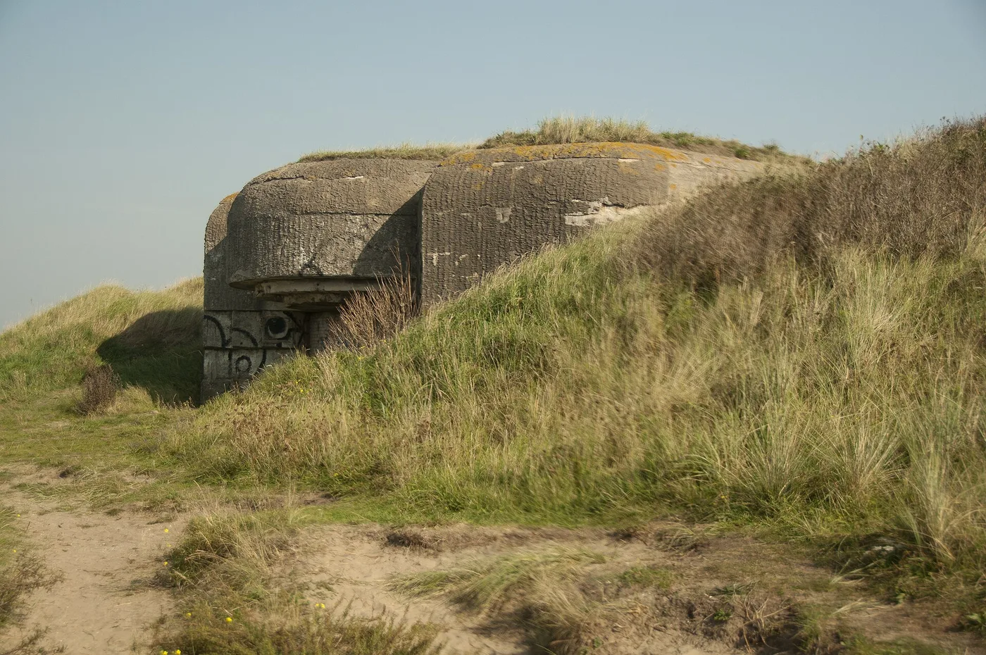 Abandoned Atlantikwall gun bunker in the dunes above the harbour of IJmuiden near Velsen-Noord
