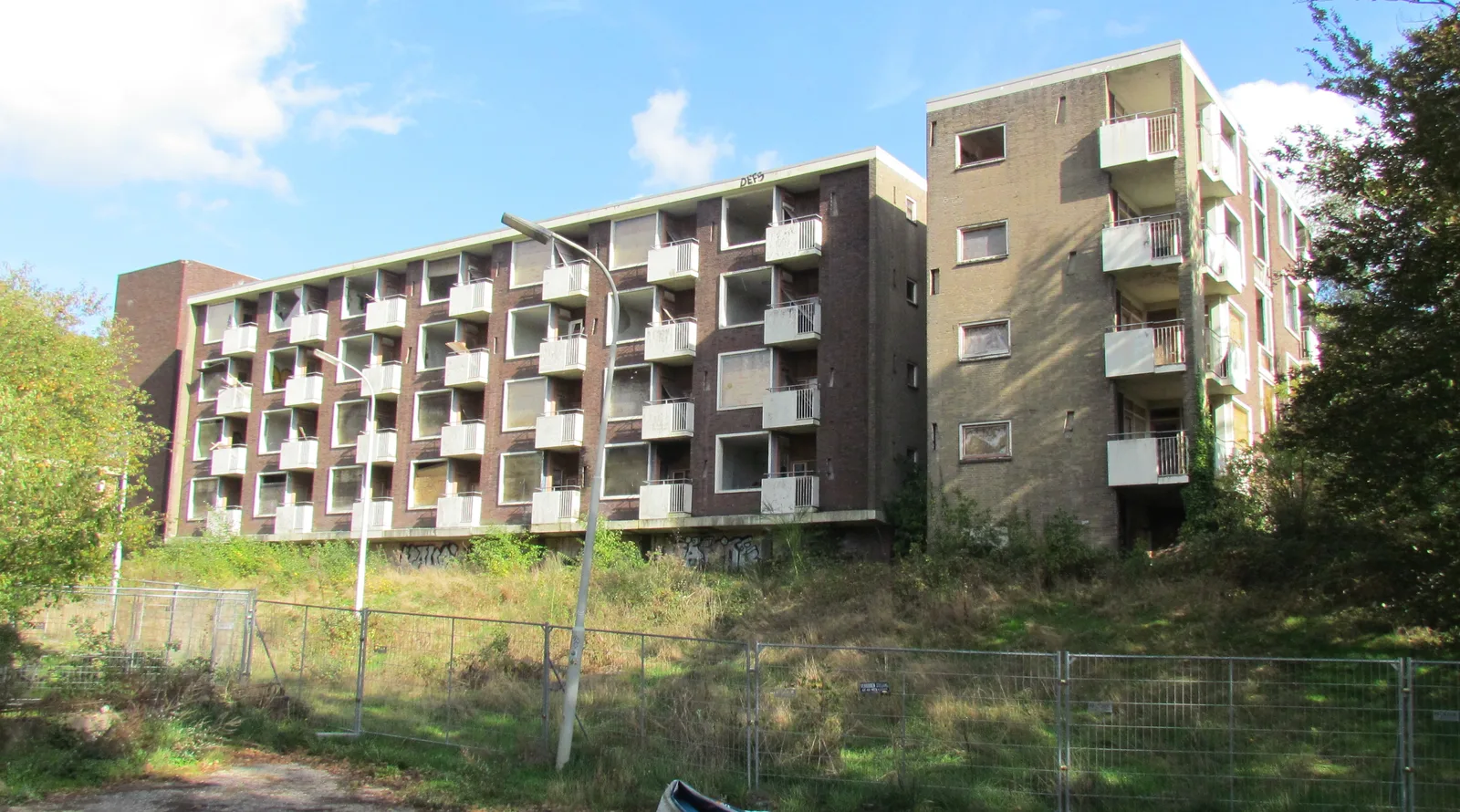Derelict, fenced-off care home of the former Rhederhof in Rheden, balconies and empty windows
