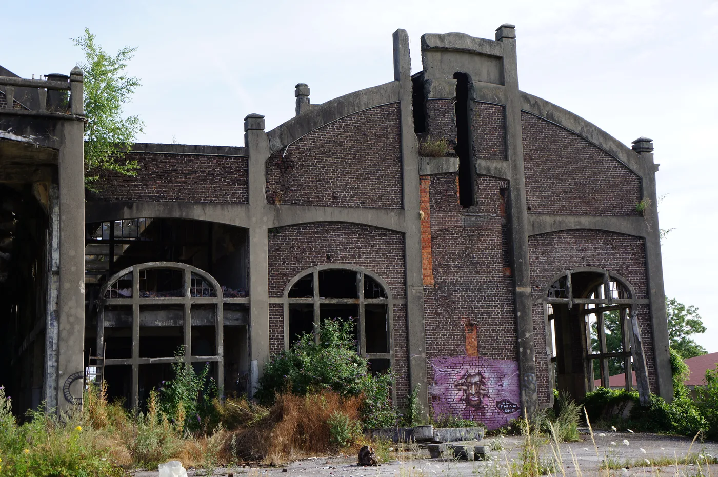 The blackened brick buildings and arches of the abandoned du Gouffre colliery No. 10
