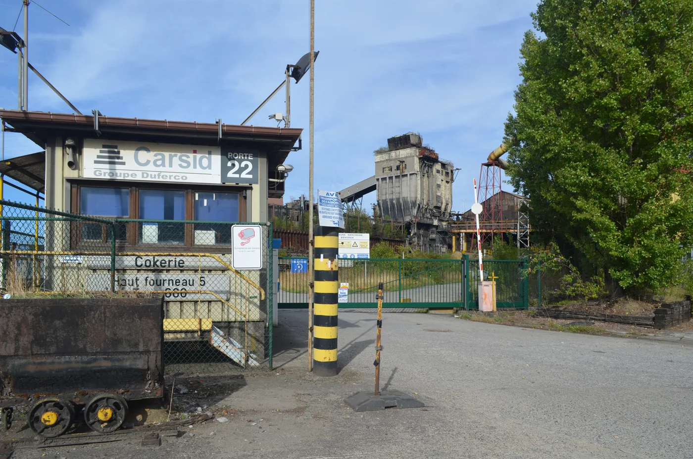 The Carsid entrance of the former Cockerill-Sambre steel site in Marchienne, with the coking plant and blast furnace in the background