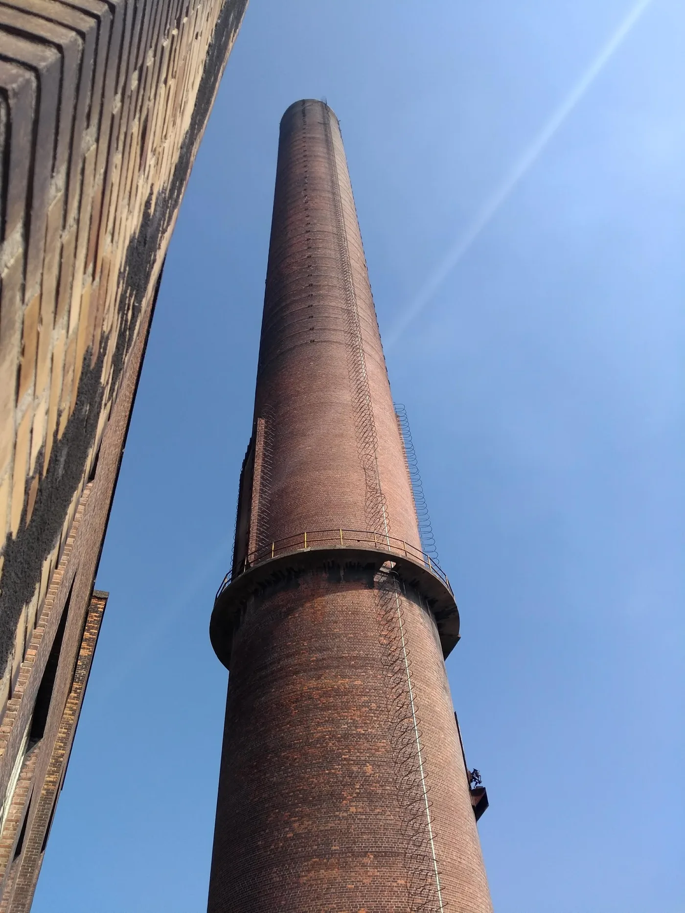 The tall brick chimney of the abandoned Langerbrugge power station in Ghent