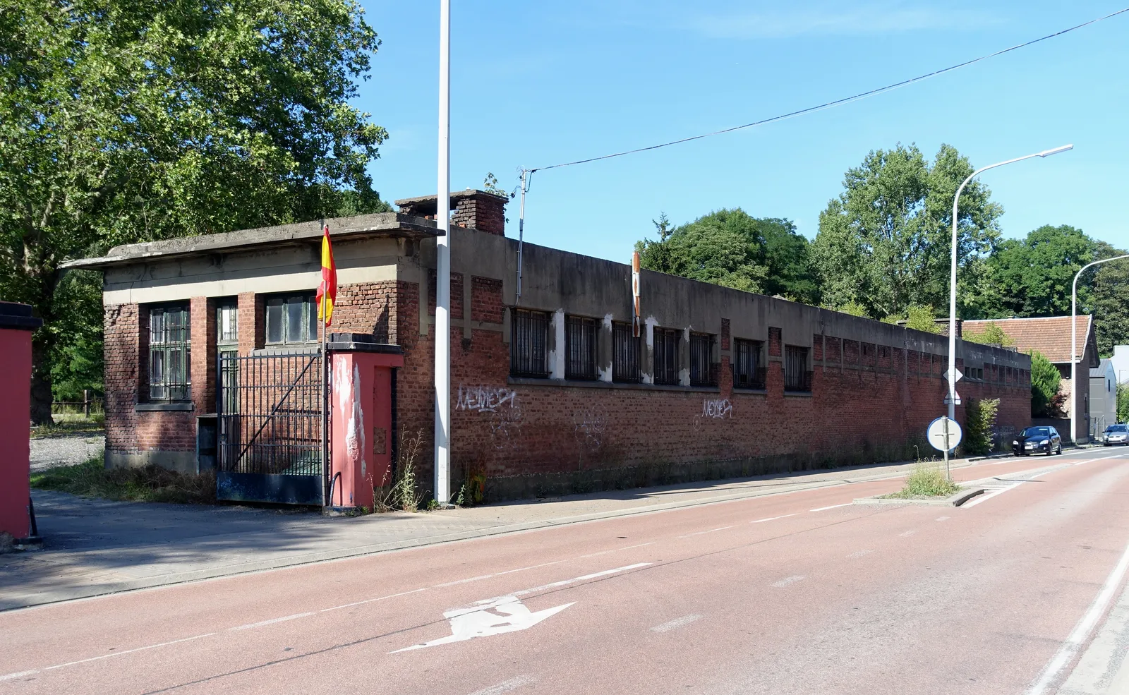 Abandoned brick building covered in graffiti of the former Charbonnage du Hasard colliery at Micheroux, Soumagne