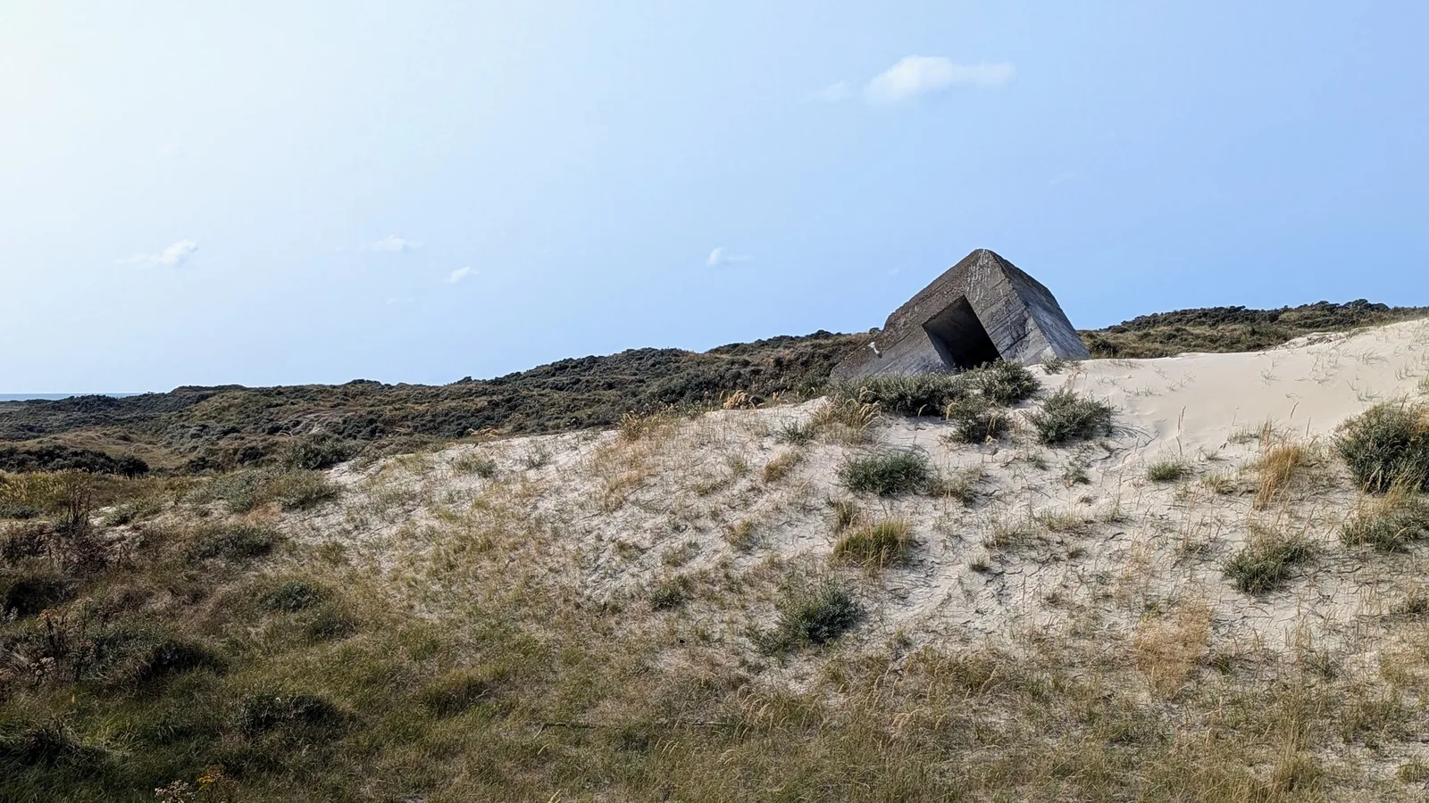 A subsided Second World War Atlantic Wall bunker in the dunes of the Kop van Schouwen
